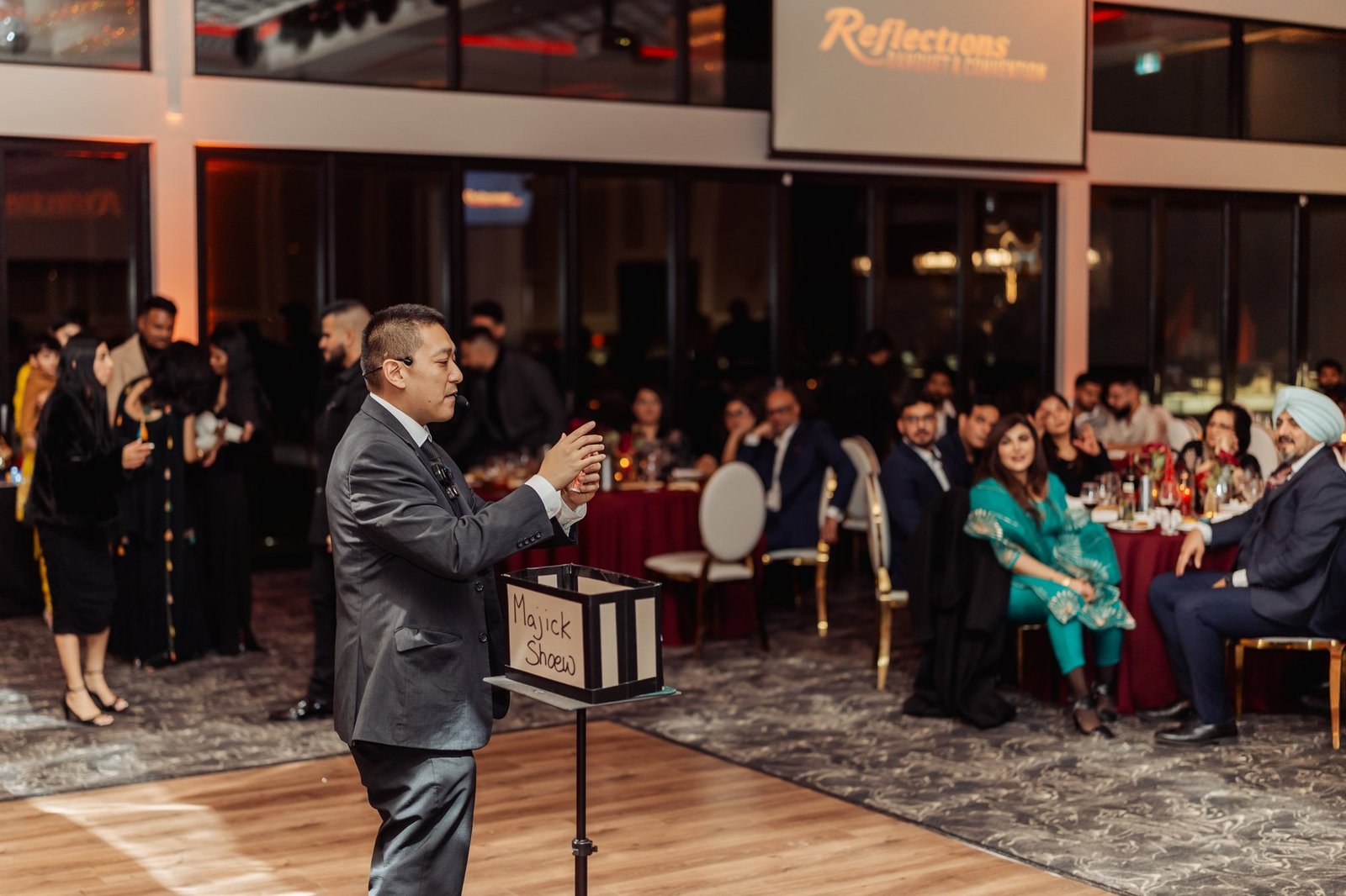 Guests watching an interactive magic and mentalism show at a Vancouver event